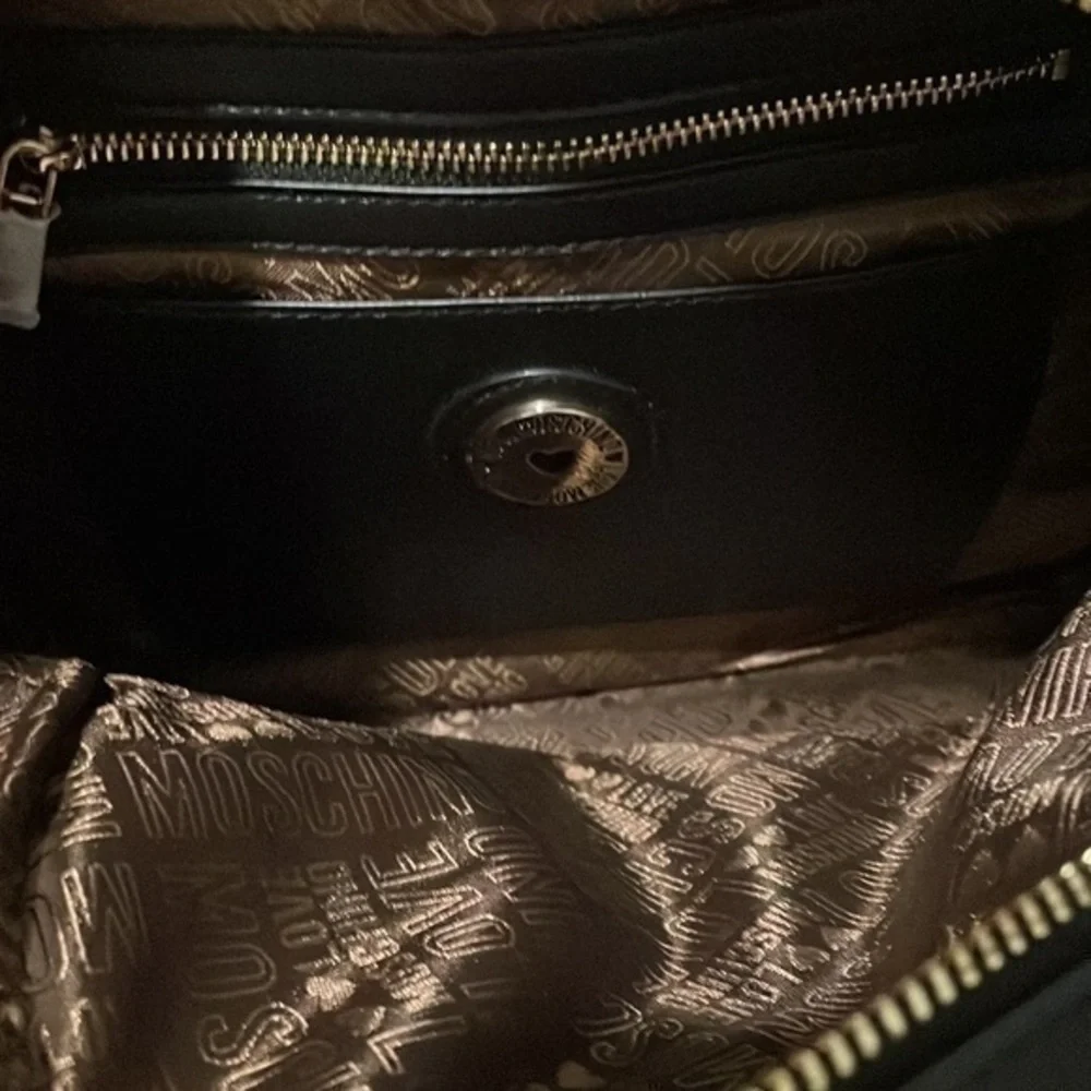 LOVE  MOSCHINO Black logo and fringe backpack